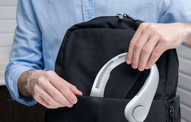 FluxoFan tucked into a backpack, ready to go